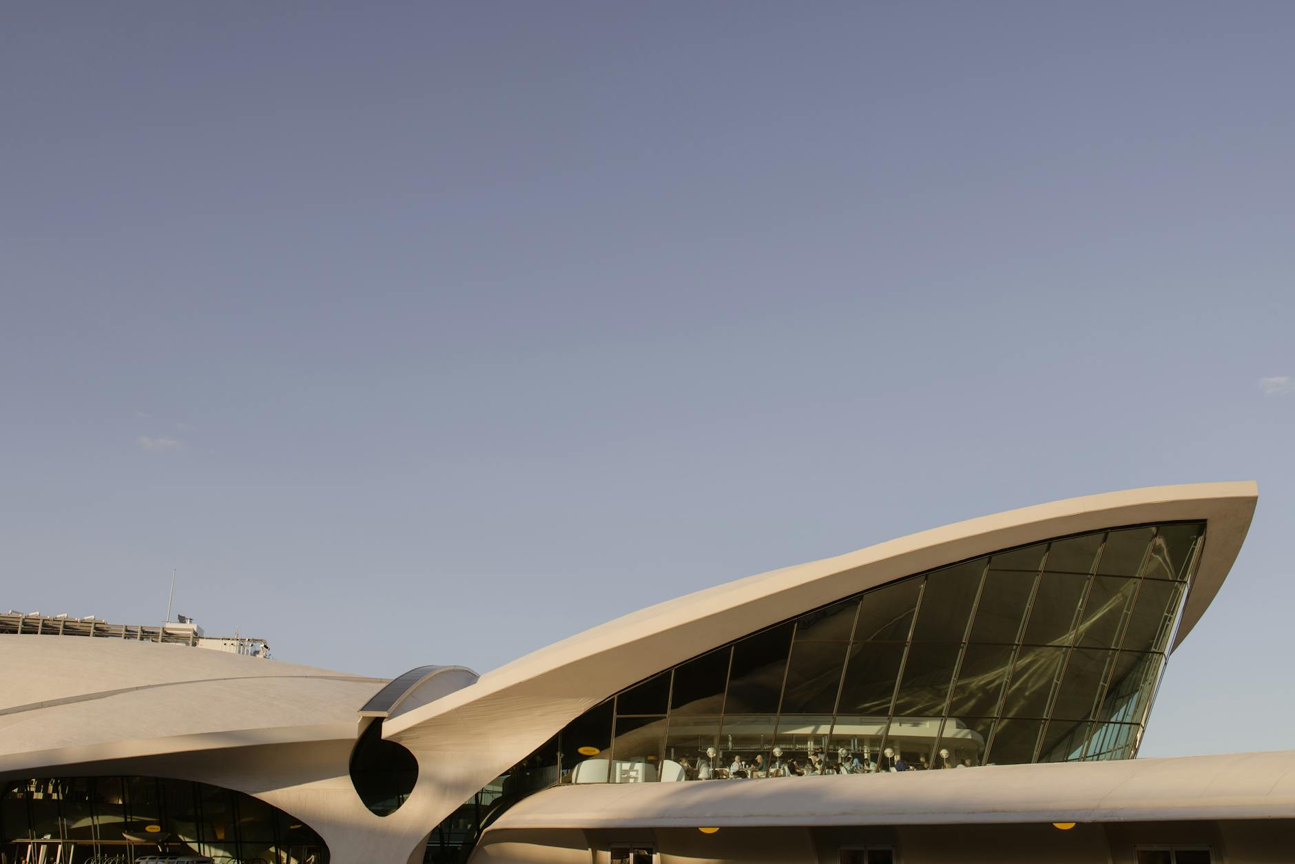Explore the architectural marvel of the TWA Flight Center at New York's JFK Airport.